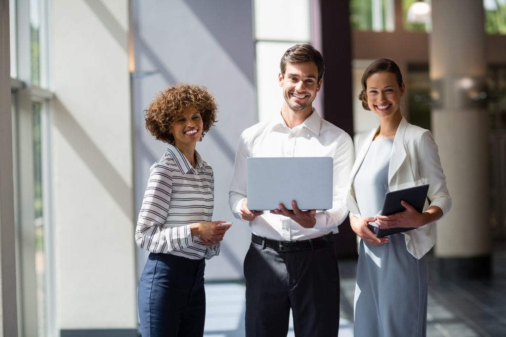 Business executives holding laptop