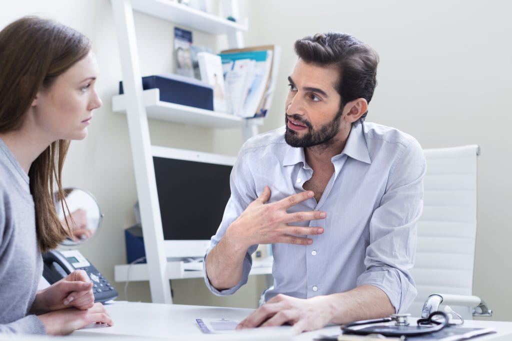 Doctor consulting with patient